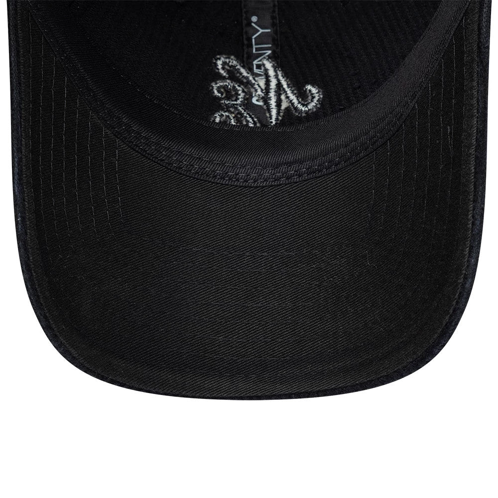 New Era Washed Cord Black 9TWENTY Adjustable Cap, inside view showing a black undervisor with prominent stitching, black sweatband and interior taping with a logo, creating a and understated design.