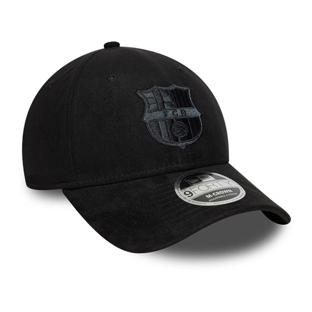 FC Barcelona Faux Suede Black New Era 9FORTY M-Crown Adjustable Cap, three-quarter view showing the black embroidered FC Barcelona crest on the front panel, curved black visor with a 9FORTY size sticker, and a structured faux suede crown.