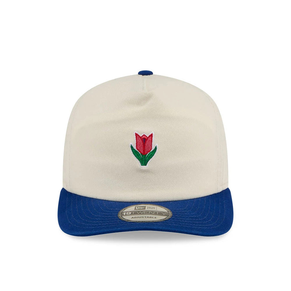 New Era Tulip Cream 19TWENTY Adjustable Cap, front view showing a red and green embroidered tulip on the cream crown, with a contrasting blue curved visor and a 19TWENTY size sticker centrally placed on the visor.