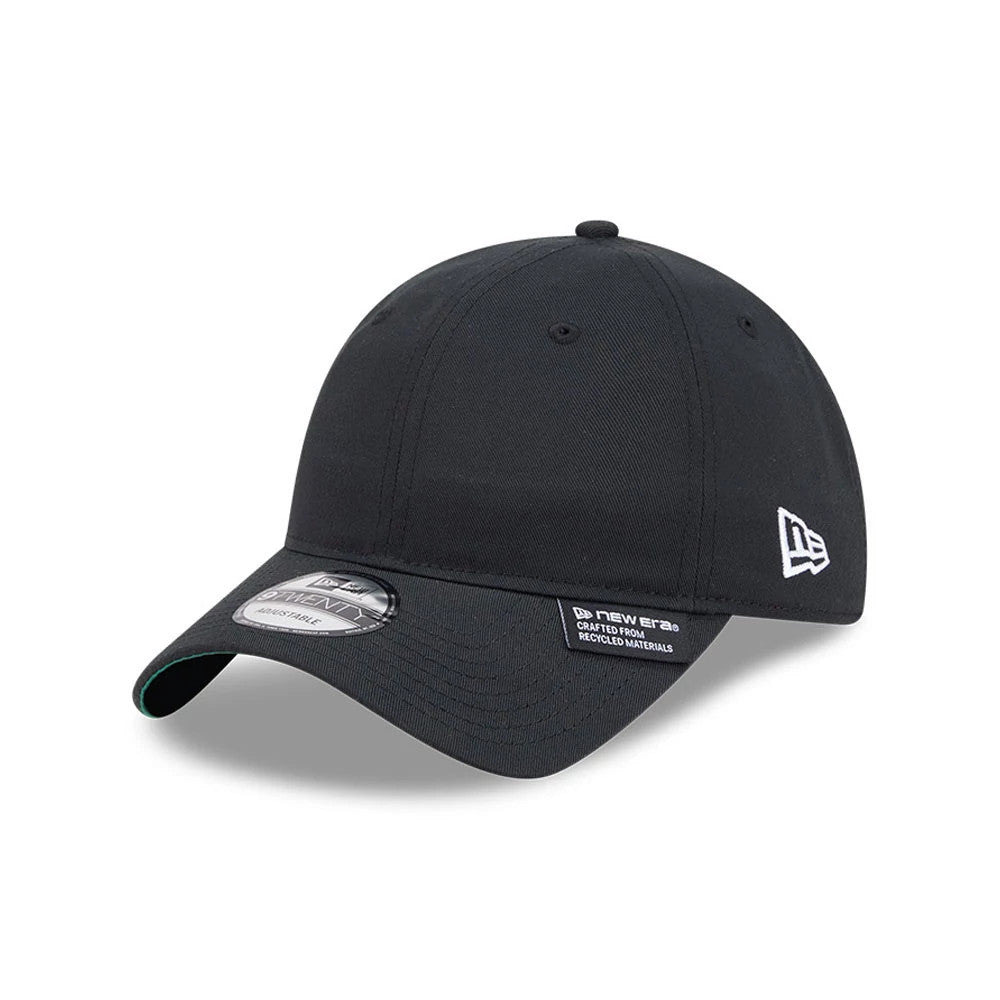 New Era Recycled Twill Black 9TWENTY Adjustable Cap, three-quarter view showing the white embroidered New Era flag logo on the left side, black curved visor with a 9TWENTY size sticker, and a green undervisor edge.