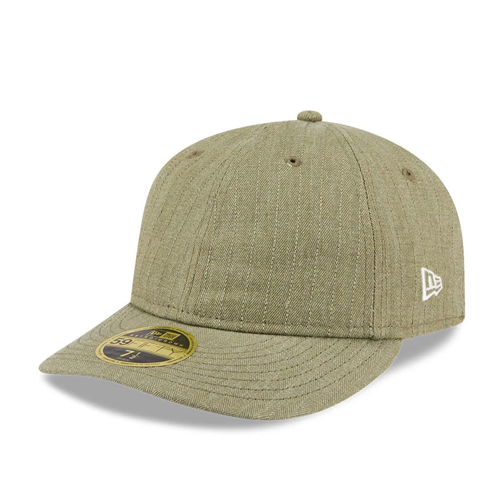 New Era Herringbone Green Retro Crown 59FIFTY Fitted Cap, three-quarter view showing the herringbone pattern on the green fabric, a white New Era flag logo embroidered on the left side, and the gold 59FIFTY size sticker on the curved visor.
