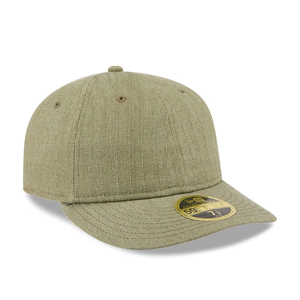 New Era Herringbone Green Retro Crown 59FIFTY Fitted Cap, three-quarter view showing the herringbone pattern across the green fabric, the curved visor design, and the gold 59FIFTY size sticker on the top of the visor.