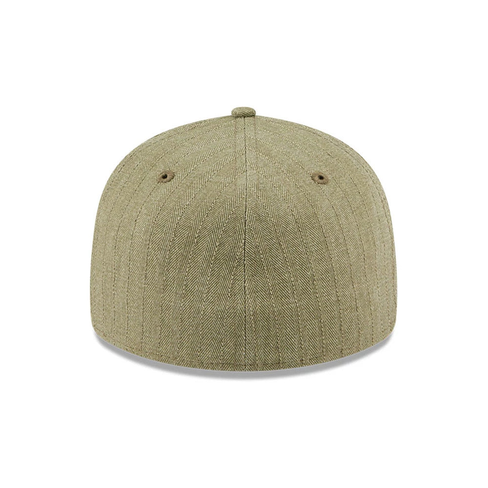 New Era Herringbone Green Retro Crown 59FIFTY Fitted Cap, rear view showing the seamless herringbone pattern on the structured green crown, with two embroidered eyelets and a matching top button.