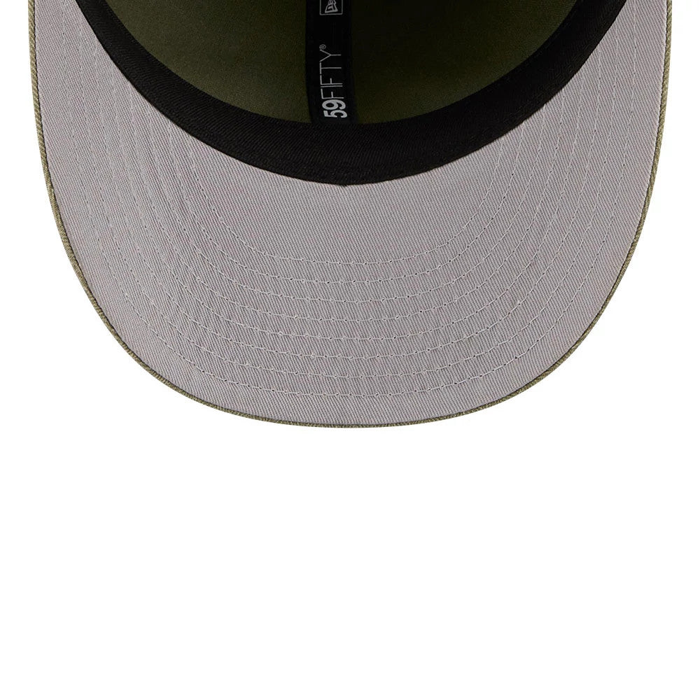 New Era Herringbone Green Retro Crown 59FIFTY Fitted Cap, inside view showing the olive undervisor, black sweatband and 59FIFTY branded taping running through the centre of the cap’s interior.
