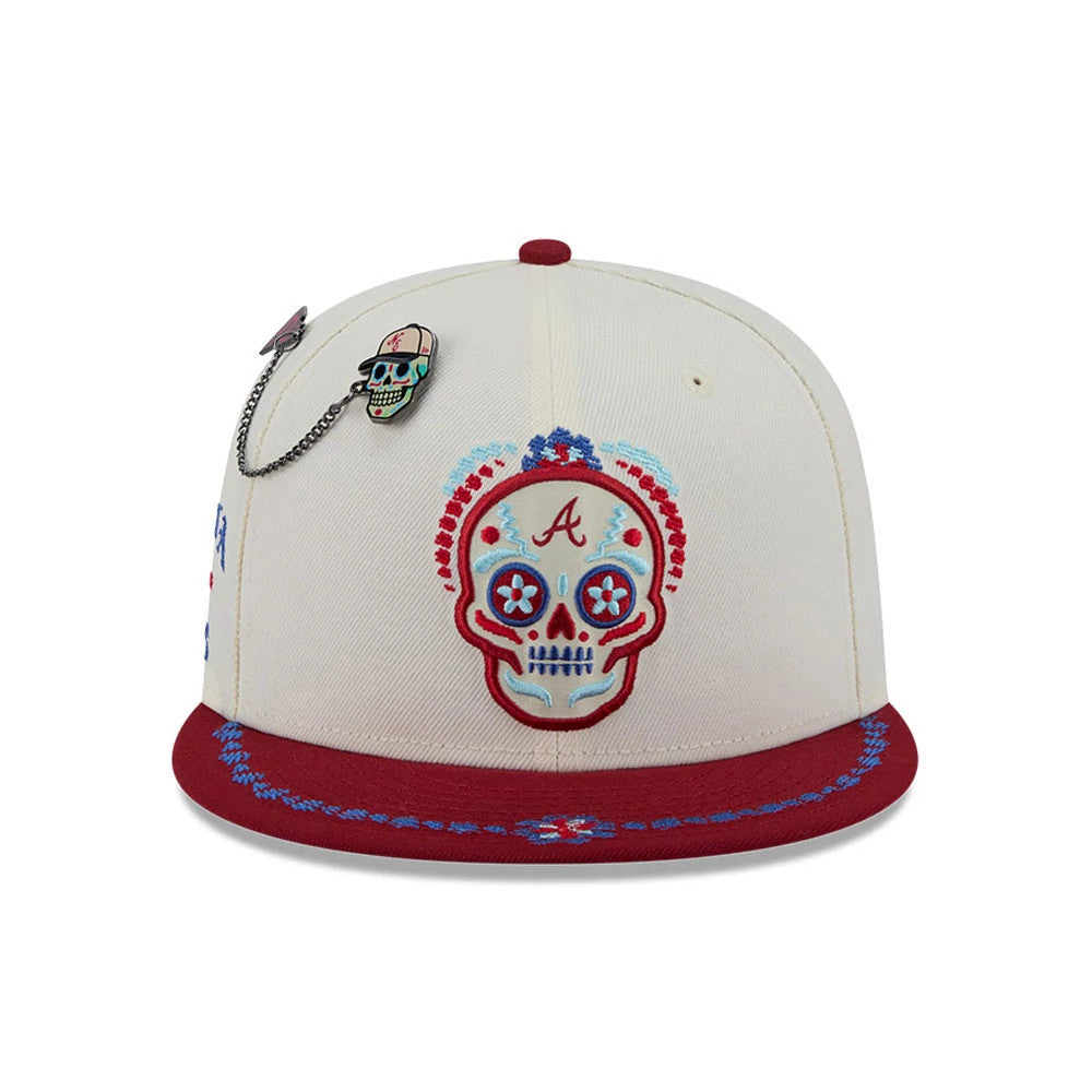 Pictured is this MLB Day Of The Dead Atlanta Braves 59FIFTY Fitted cap in light beige & dark red. 3