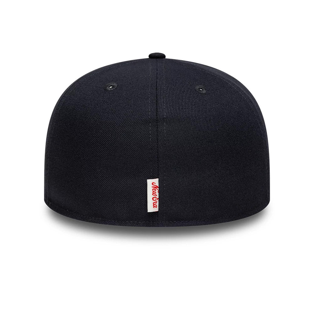 New Era Oval Patch Navy 59FIFTY Fitted Cap, rear view showing a white woven label with red New Era script below the central seam, positioned on a dark navy structured crown with matching eyelets and a top button.
