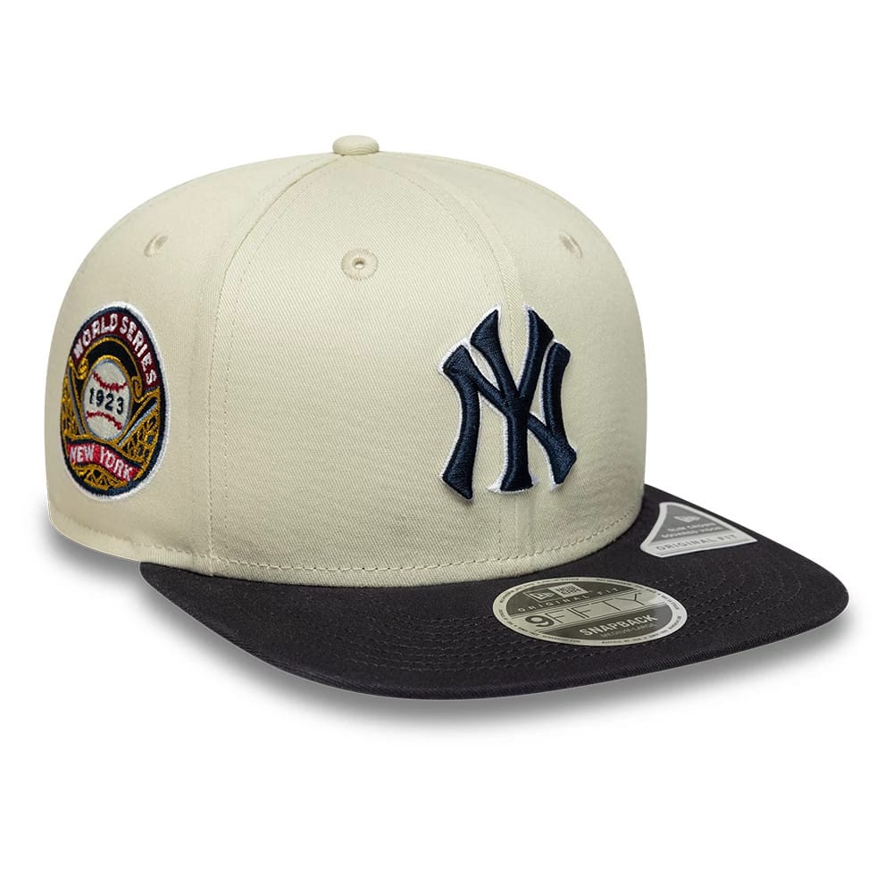 Pictured is this MLB World Series Patch New York Yankees 9FIFTY Snapback Adjustable cap in light beige. 1