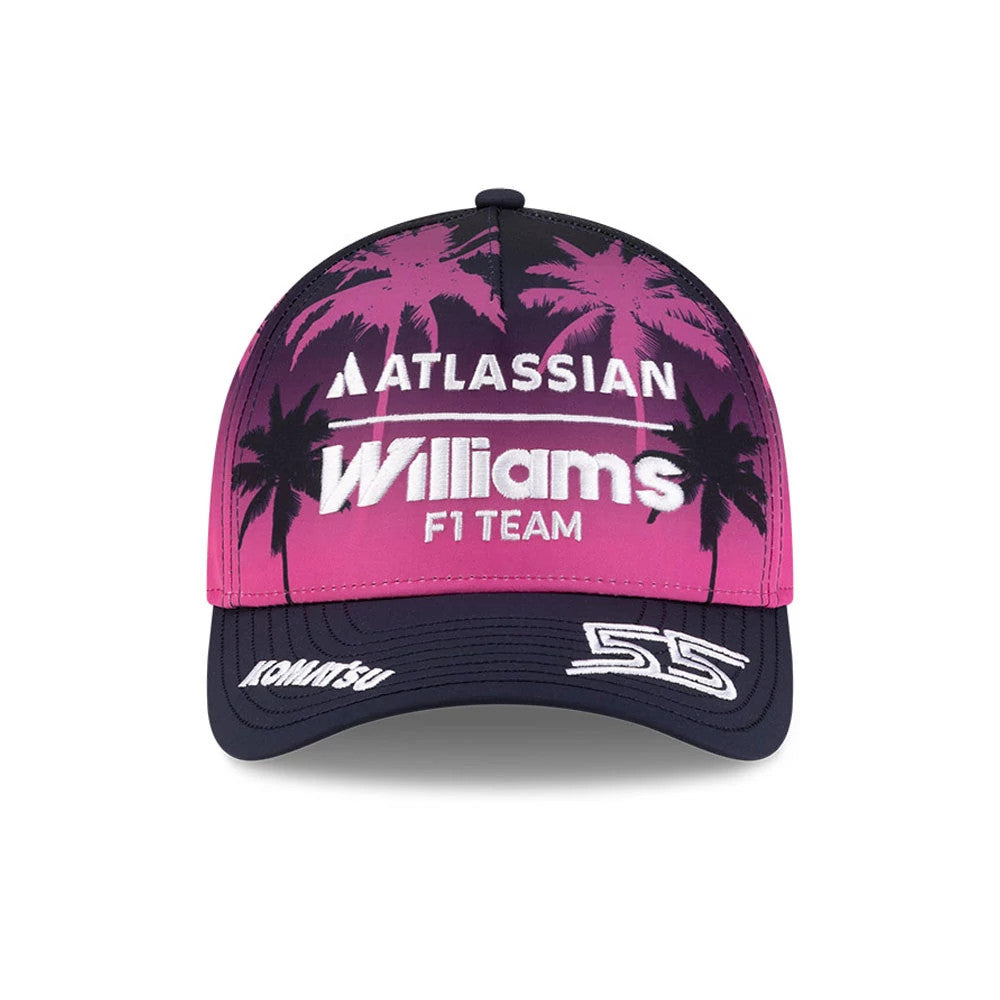 Williams Carlos Sainz Miami Navy New Era 9FORTY M-Crown A-Frame Adjustable Cap, front view showing white embroidered Williams F1 lettering on a pink backdrop featuring black palm trees, with extra white Komatsu and 55 details on the navy visor.