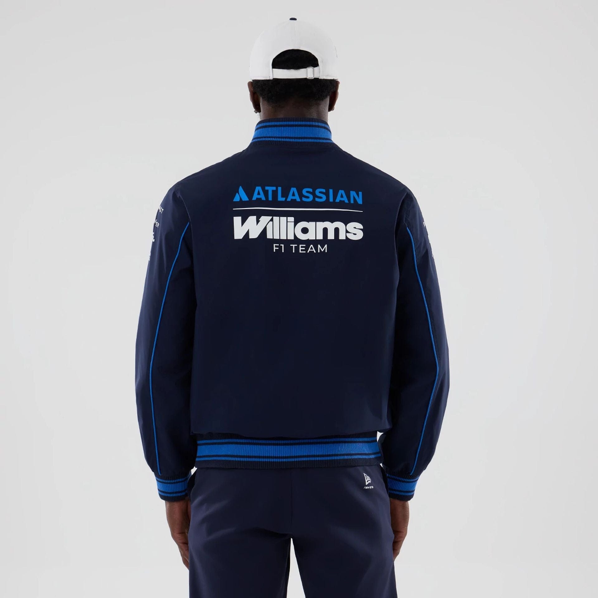 The model is wearing this Atlassian Williams F1 Team Varsity Jacket in navy. 2