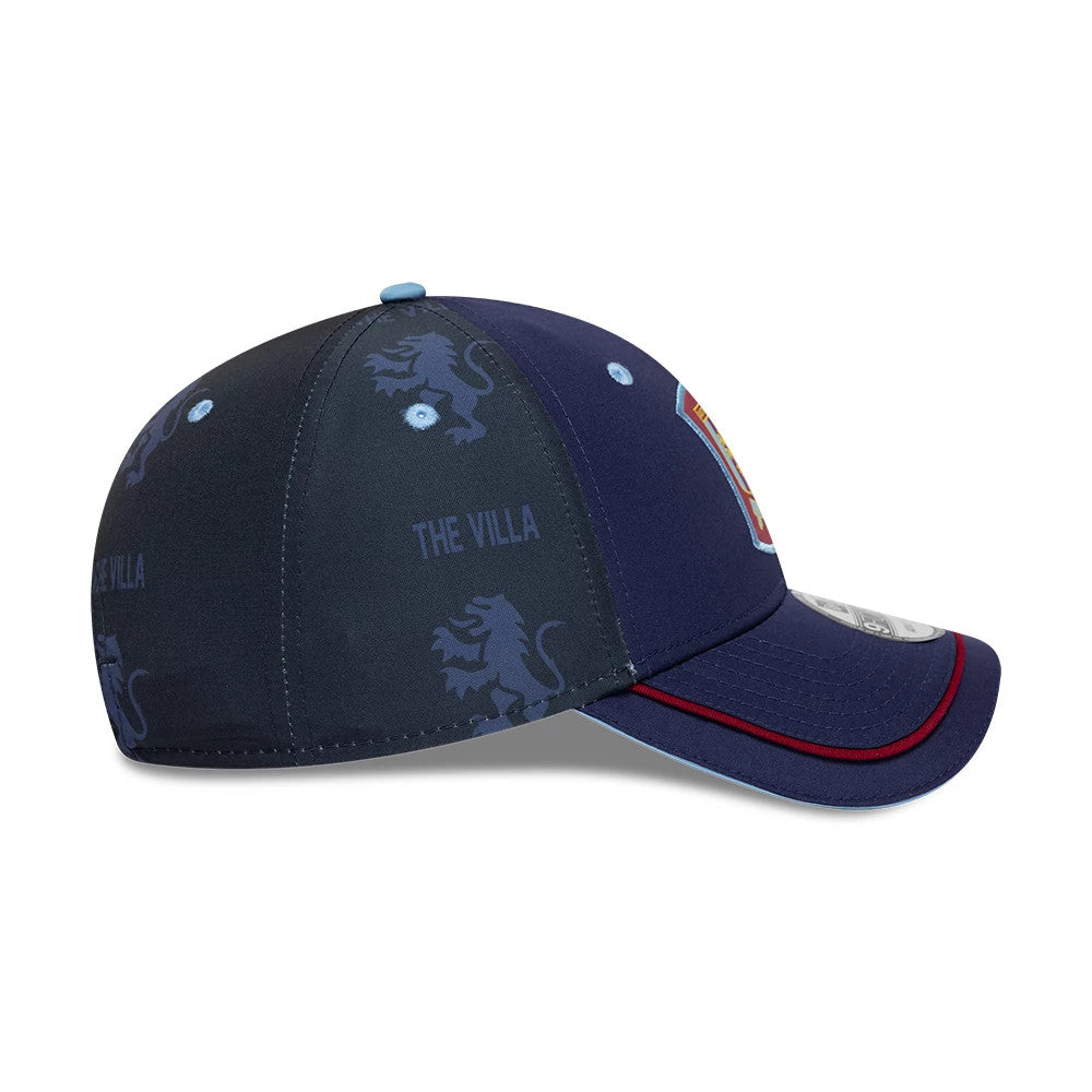 Aston Villa FC 96 Navy New Era 9FORTY Adjustable Cap, side view showing the light blue embroidered eyelets on a navy crown with Villa lion graphics, a light blue top button, and a navy curved visor with a burgundy stripe and 9FORTY size sticker.