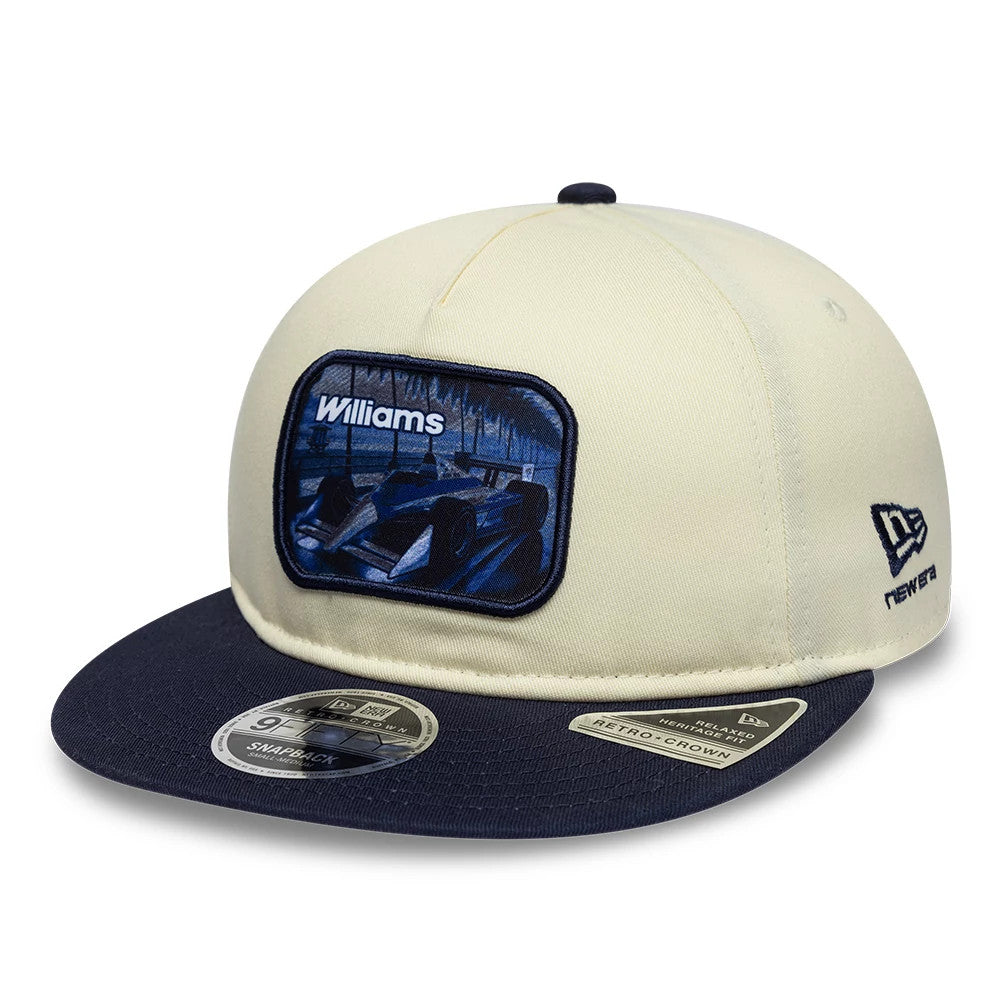 Williams New Wave Cream Retro Crown New Era 9FIFTY Adjustable Cap, three-quarter view showing a blue embroidered racing car patch with Williams lettering on the cream front panel, a dark blue flat visor, and New Era flag logo on the left side.