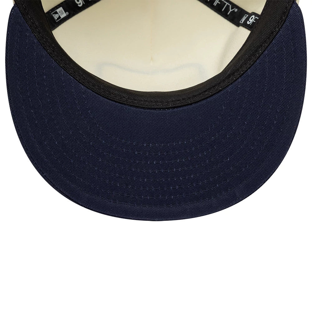 Williams New Wave Cream Retro Crown New Era 9FIFTY Adjustable Cap, inside view showing the dark undervisor with stitching, black sweatband with white New Era branding, and cream-coloured lining inside the crown.