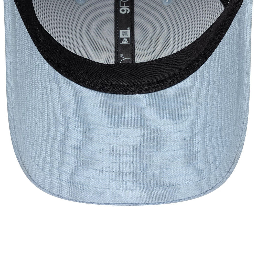 Williams New Wave Linen Pastel Blue New Era 9FORTY Adjustable Cap, inside view showing the black sweatband, pastel blue undervisor, and black and white taping featuring the 9FORTY logo detail extending across the inner crown.