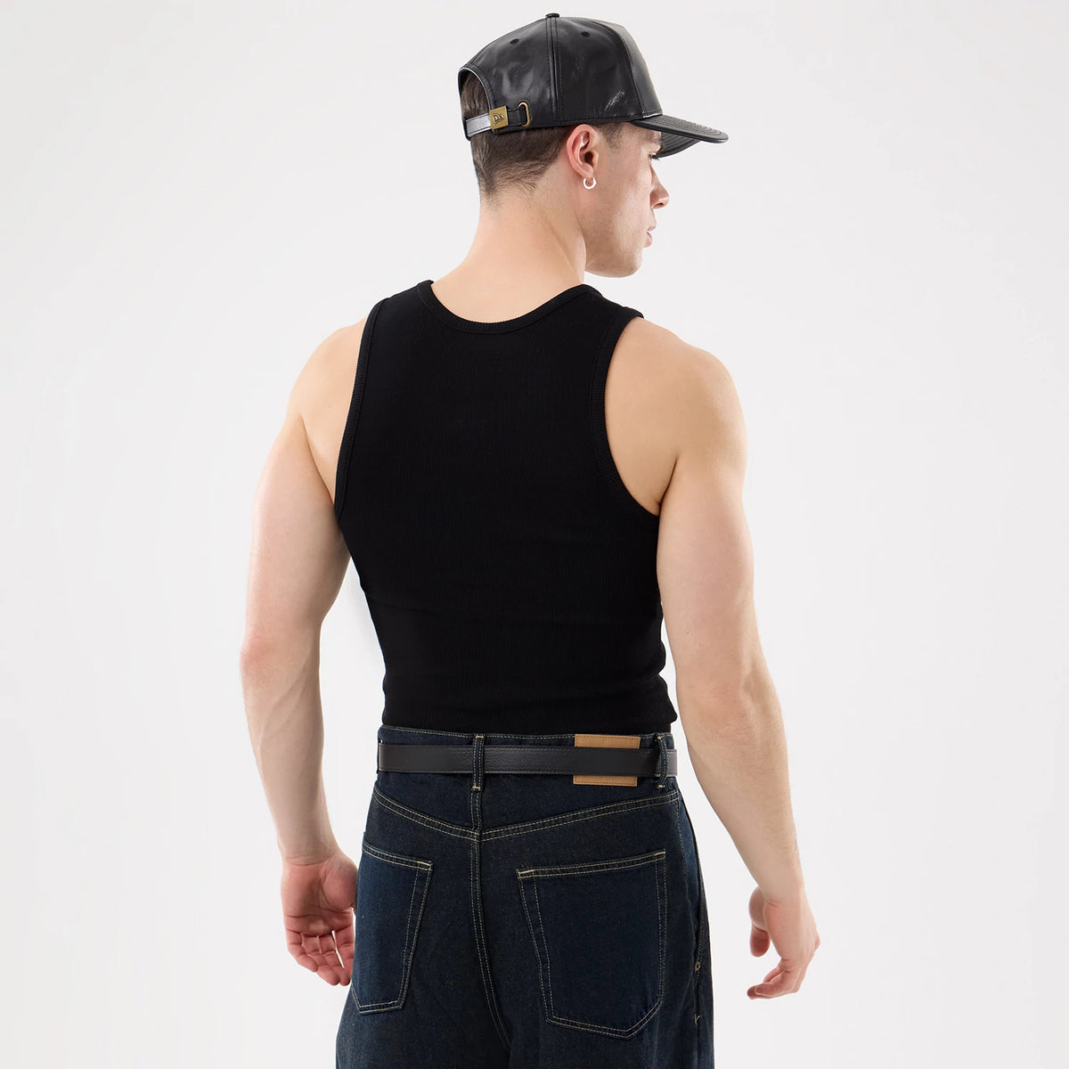 New Era New York Yankees MLB Rib Black Vest, rear view on a model styled with a black cap, showing the sleeveless ribbed design and fitted cut, highlighting the back and shoulder details.