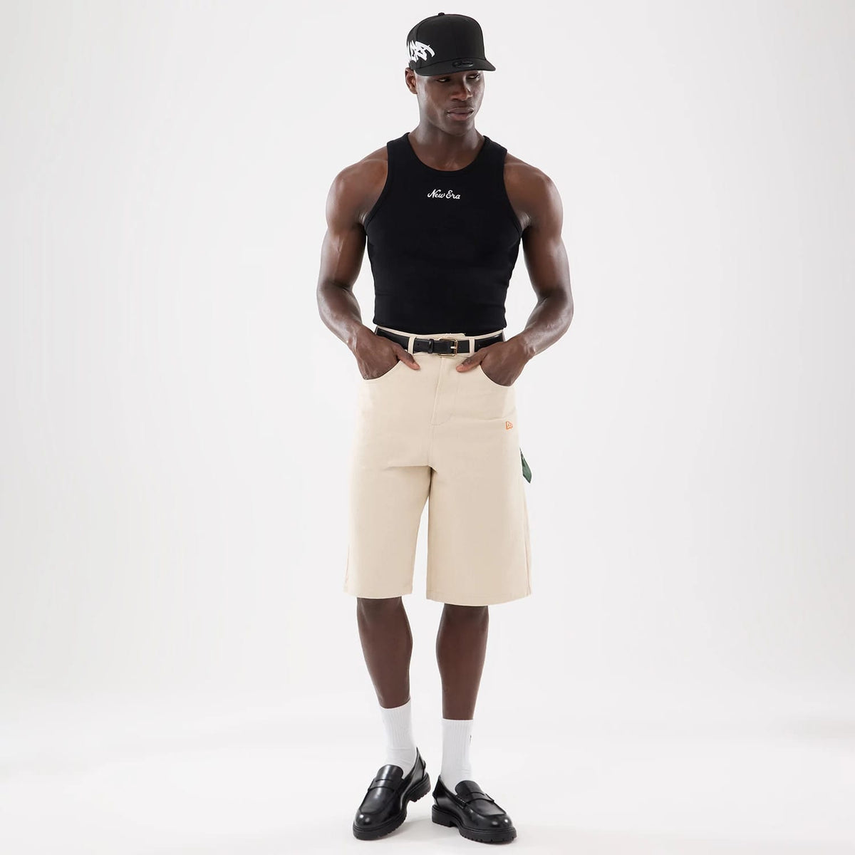 The model is wearing this New Era Rib Vest in black. 3
