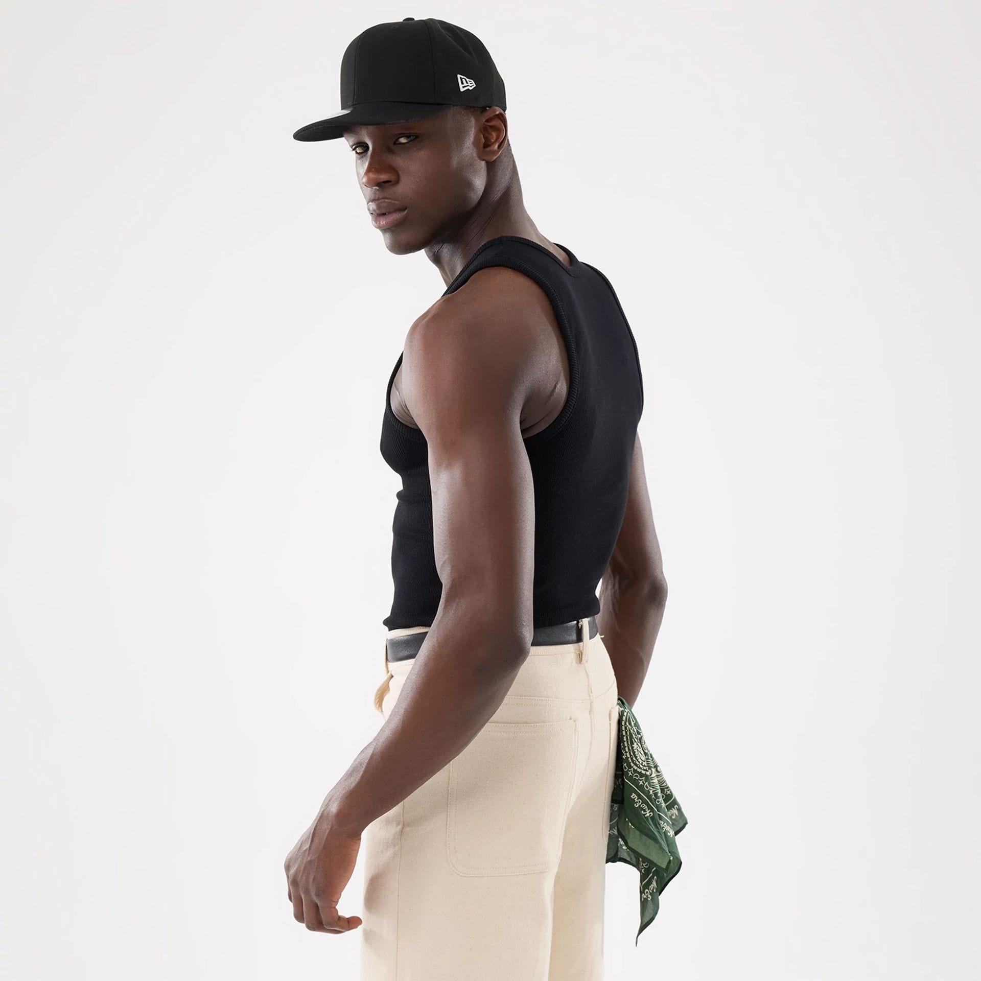 The model is wearing this New Era Rib Vest in black. 9
