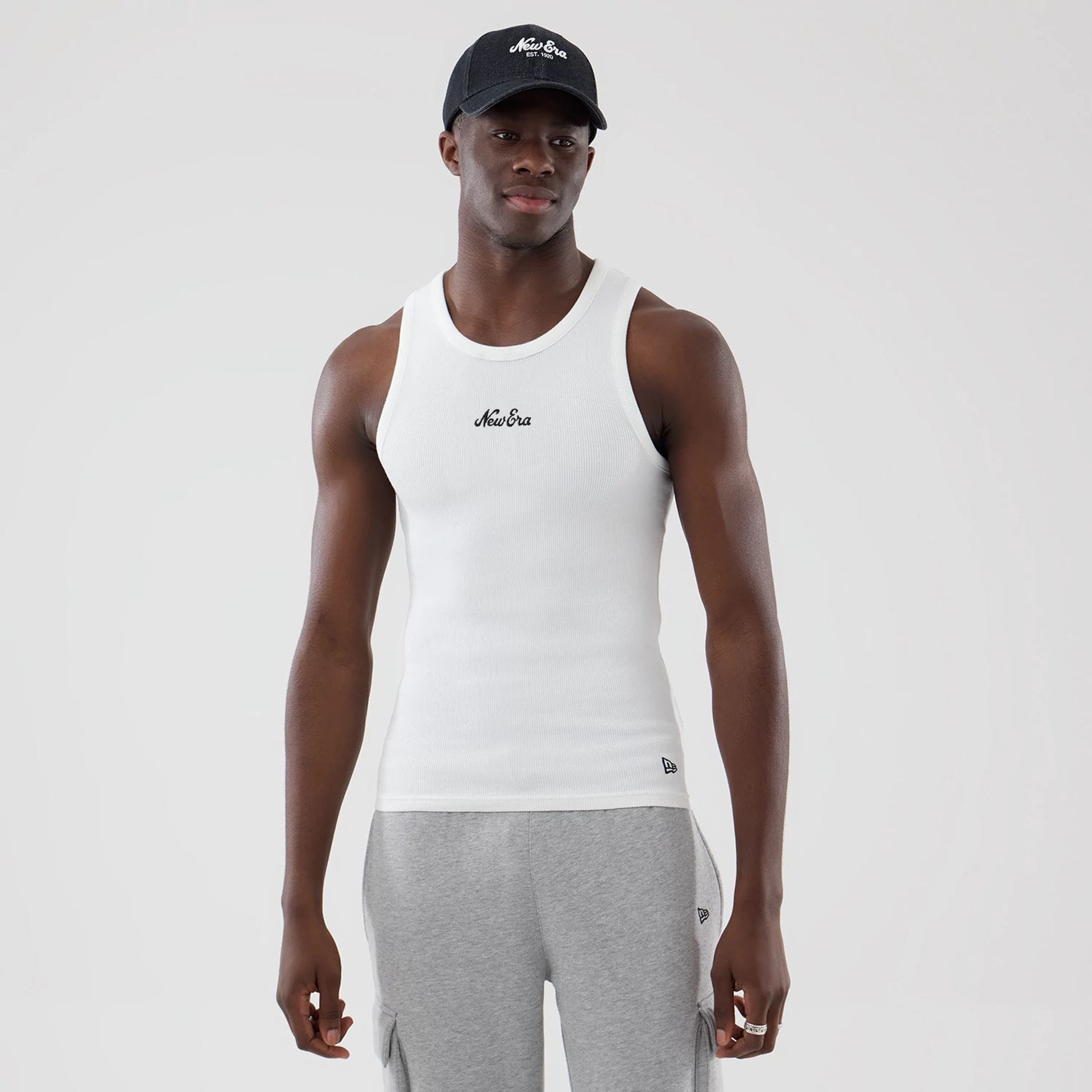 The model is wearing this New Era Rib Vest in white. 1