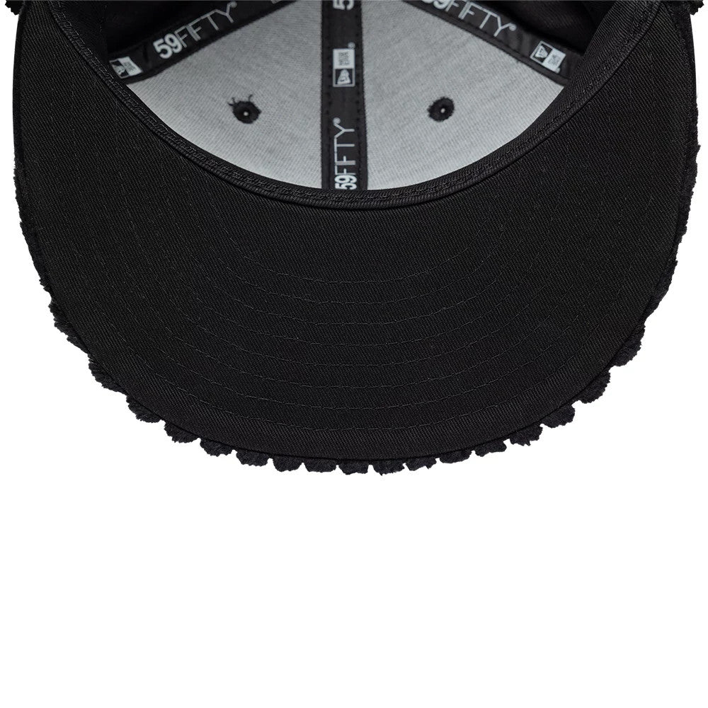 Mains X New Era Cord Black Dogear 59FIFTY Fitted Cap, inside view showing the grey sweatband with black 59FIFTY taping, black eyelets on the inner fabric, and the black visor with a matching textured edge.