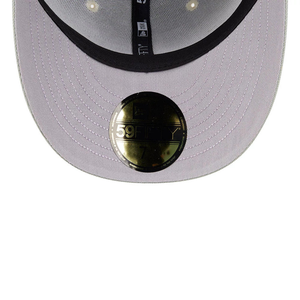 Athletics MLB Pastel Green New Era 59FIFTY Fitted Cap, inside view showing a black sweatband with New Era branding, a grey undervisor with a gold 59FIFTY size sticker, and black-and-white taping across the crown's panels.