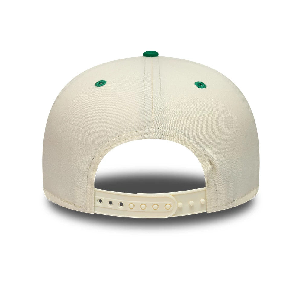 Boston Celtics NBA Hardwood Classic Cream & Green New Era 19TWENTY Adjustable Cap, rear view showing a cream plastic strap with multiple adjustment holes, green embroidered eyelets on the back cream panels, and a green top button.