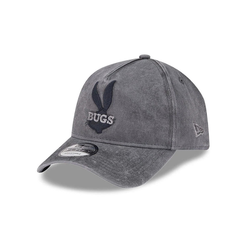 Bugs Bunny Looney Tunes Grey New Era 9FORTY A-Frame Adjustable Cap, three-quarter view showing navy raised Bugs Bunny logo on front panel, curved grey visor with 9FORTY size sticker, and New Era flag logo on the left side.