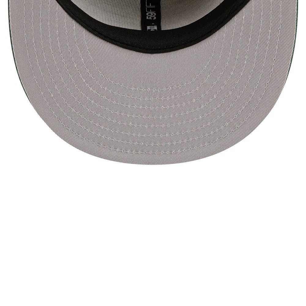New York Yankees MLB Agave 2Tone Light Beige & Green New Era 59FIFTY Fitted Cap, inside view showing the grey undervisor with white stitching, black sweatband featuring a white 59FIFTY tag, and MLB logo tag on the crown seam.