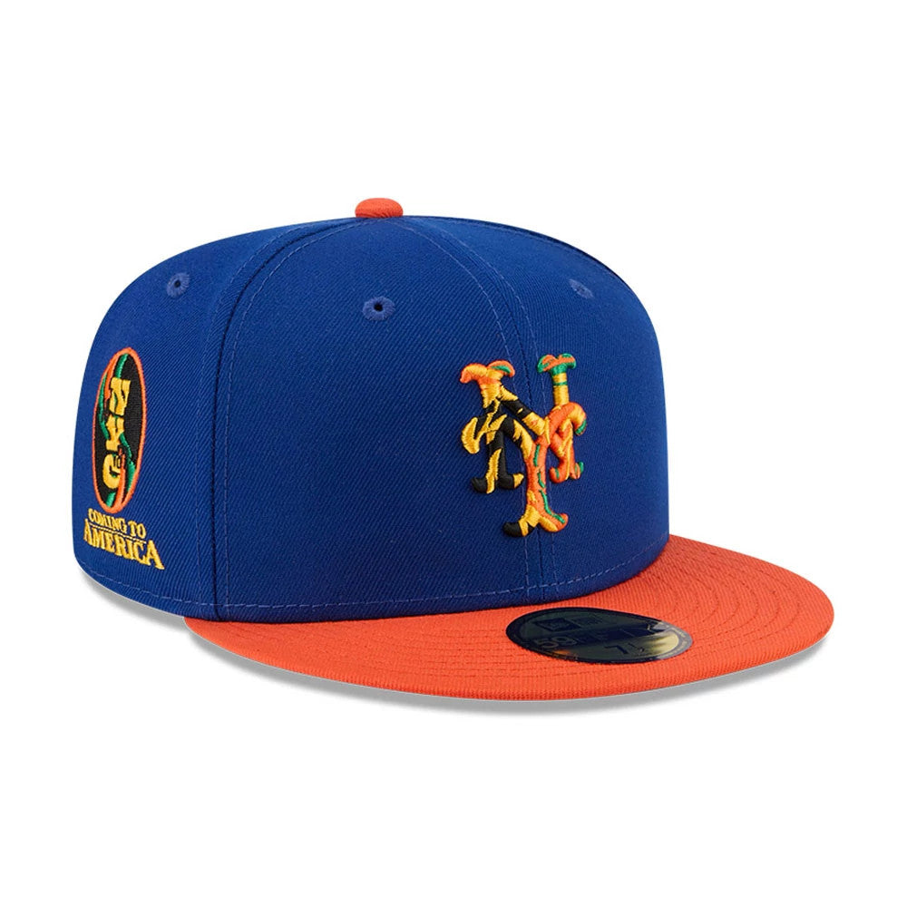 New York Mets MLB X Coming To America Blue New Era 59FIFTY Fitted Cap, three-quarter view showing the embroidered graphic on the front panel, the blue structured crown with matching eyelets, and an orange flat visor with a 59FIFTY size sticker.