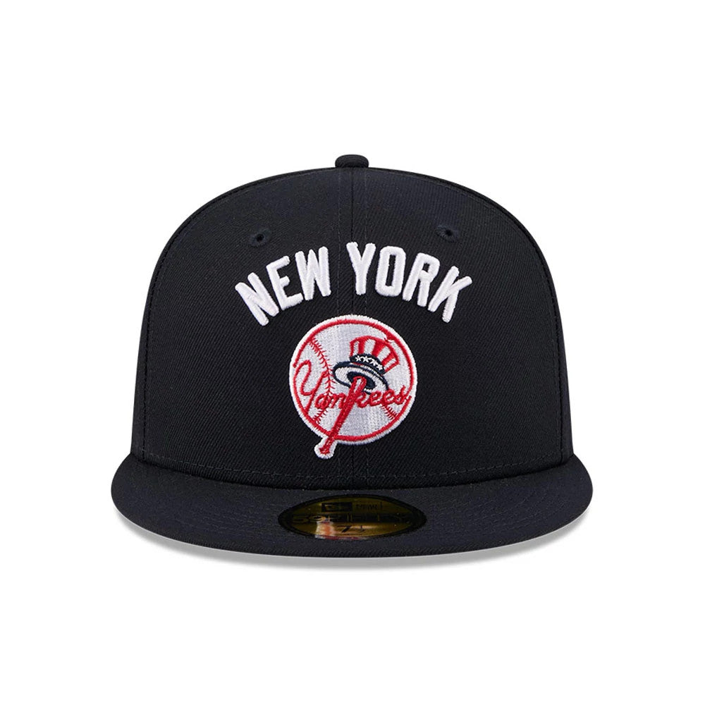 New York Yankees MLB X Seinfeld Navy New Era 59FIFTY Fitted Cap, front view showing white raised New York embroidery and the Yankees logo in red and white on the navy front panel, with a flat navy visor and gold 59FIFTY size sticker.