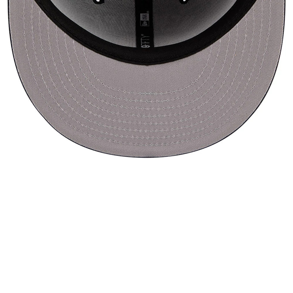 New York Yankees MLB X Seinfeld Navy New Era 59FIFTY Fitted Cap, inside view showing a grey undervisor with black interior taping and a black sweatband, featuring the 59FIFTY and New Era logos on the taping.