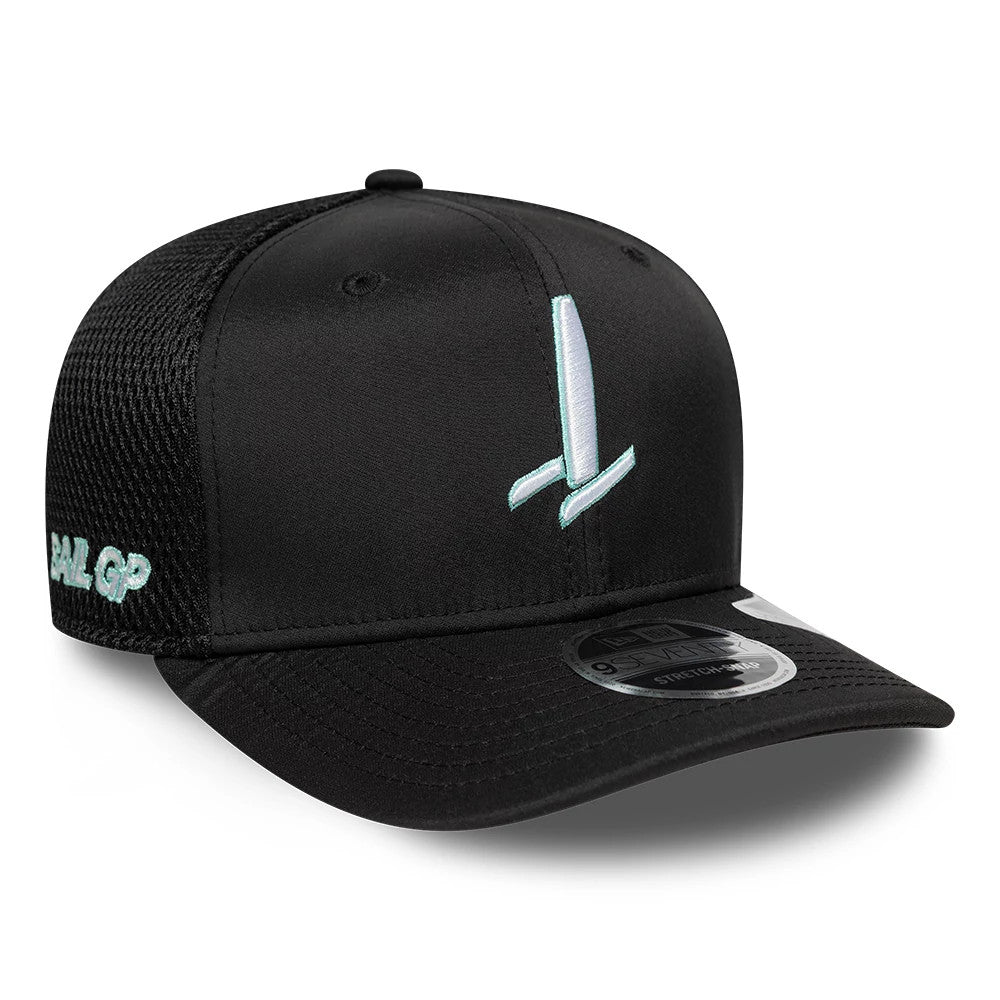 Sail GP Catamaran Black New Era 9SEVENTY Stretch Snap Adjustable Cap, front view showing the light blue embroidered catamaran graphic on the black front panel, black curved visor with 9SEVENTY size sticker, and mesh material on the side.