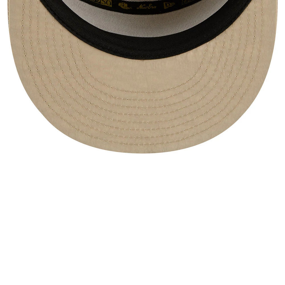 New Era 59FIFTY Day Cream Split Panel 59FIFTY Fitted Cap, inside view showing the cream undervisor with detailed stitching, a black sweatband with golden New Era branding, and an inner panel with black and yellow taping.