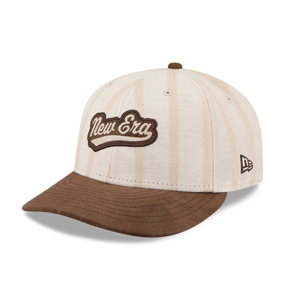 New Era 59FIFTY Day Open Beige Low Profile 59FIFTY Fitted Cap, three-quarter view showing the brown embroidered New Era script logo on the front panel, beige striped crown with eyelets, and contrasting brown visor.