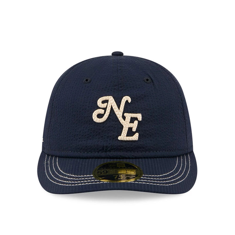 New Era 59FIFTY Day Seersucker Navy Retro Crown 59FIFTY Fitted Cap, front view showing the cream NE lettering in raised embroidery on the structured navy crown, curved navy visor with white stitching, and gold 59FIFTY size sticker.