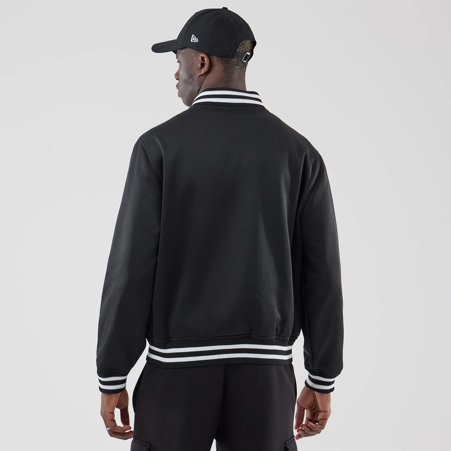 The model is wearing this MLB Jersey Bomber Detroit Tigers Jacket in black. 2