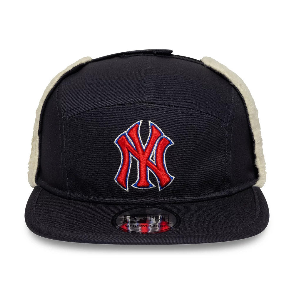New Era New York Yankees MLB Navy Dogear Camper Adjustable Cap, front view showing a red and white embroidered NY logo on the front panel, with faux fur-lined ear flaps and a black visor featuring a size sticker on top.