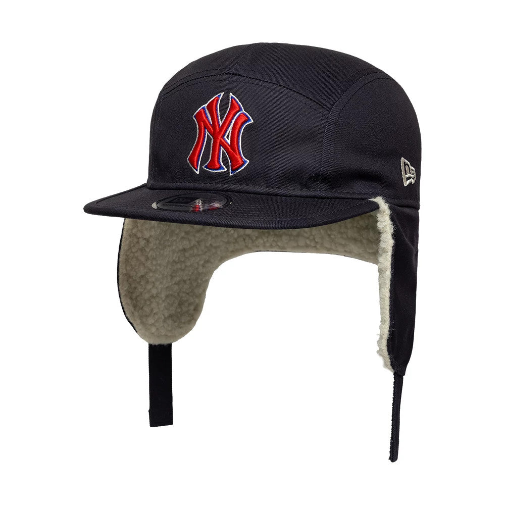 New Era New York Yankees MLB Navy Dogear Camper Adjustable Cap, three-quarter view showing a red and white embroidered Yankees logo on the front panel, black visor with a 9FORTY size sticker, and ear flaps lined with soft faux fur.