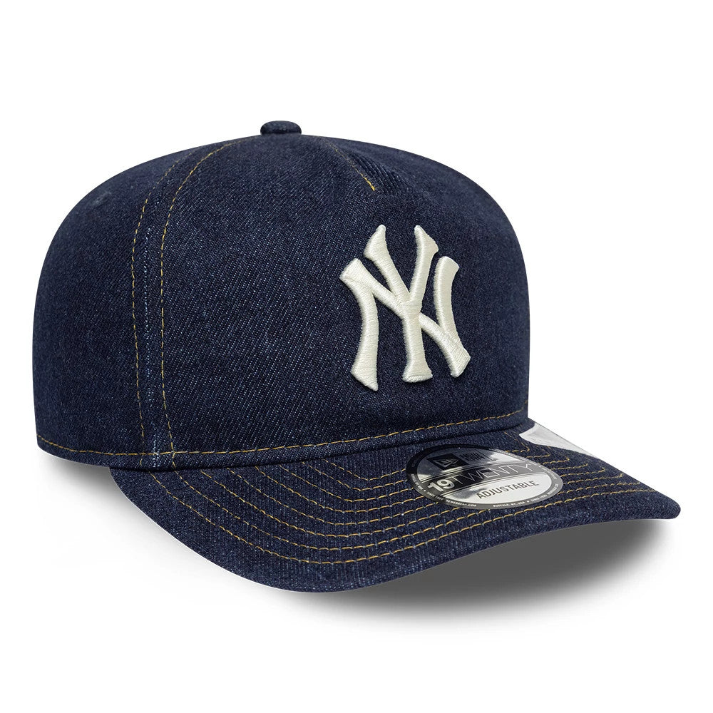 New York Yankees MLB Denim Navy New Era 19TWENTY Adjustable Cap, three-quarter view showing the raised white embroidered NY logo on the front panel, navy denim fabric with contrast stitching, and the 19TWENTY size sticker on the flat visor.