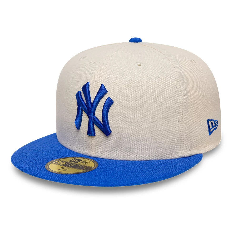 Pictured is this MLB League Essential New York Yankees 59FIFTY Fitted cap in blue. 1