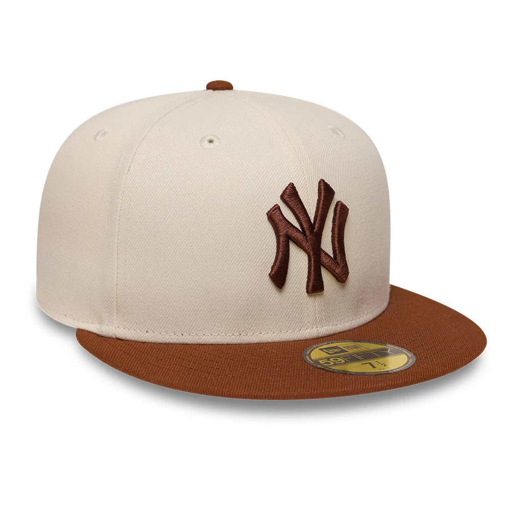 Pictured is this MLB League Essential New York Yankees 59FIFTY Fitted cap in cream. 3