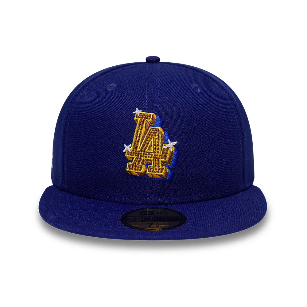 LA Dodgers MLB Emblem Dark Blue New Era 59FIFTY Fitted Cap, front view showing the intricately embroidered gold LA logo with a textured pattern on the dark blue crown, accompanied by a black 59FIFTY size sticker centred on the flat visor.