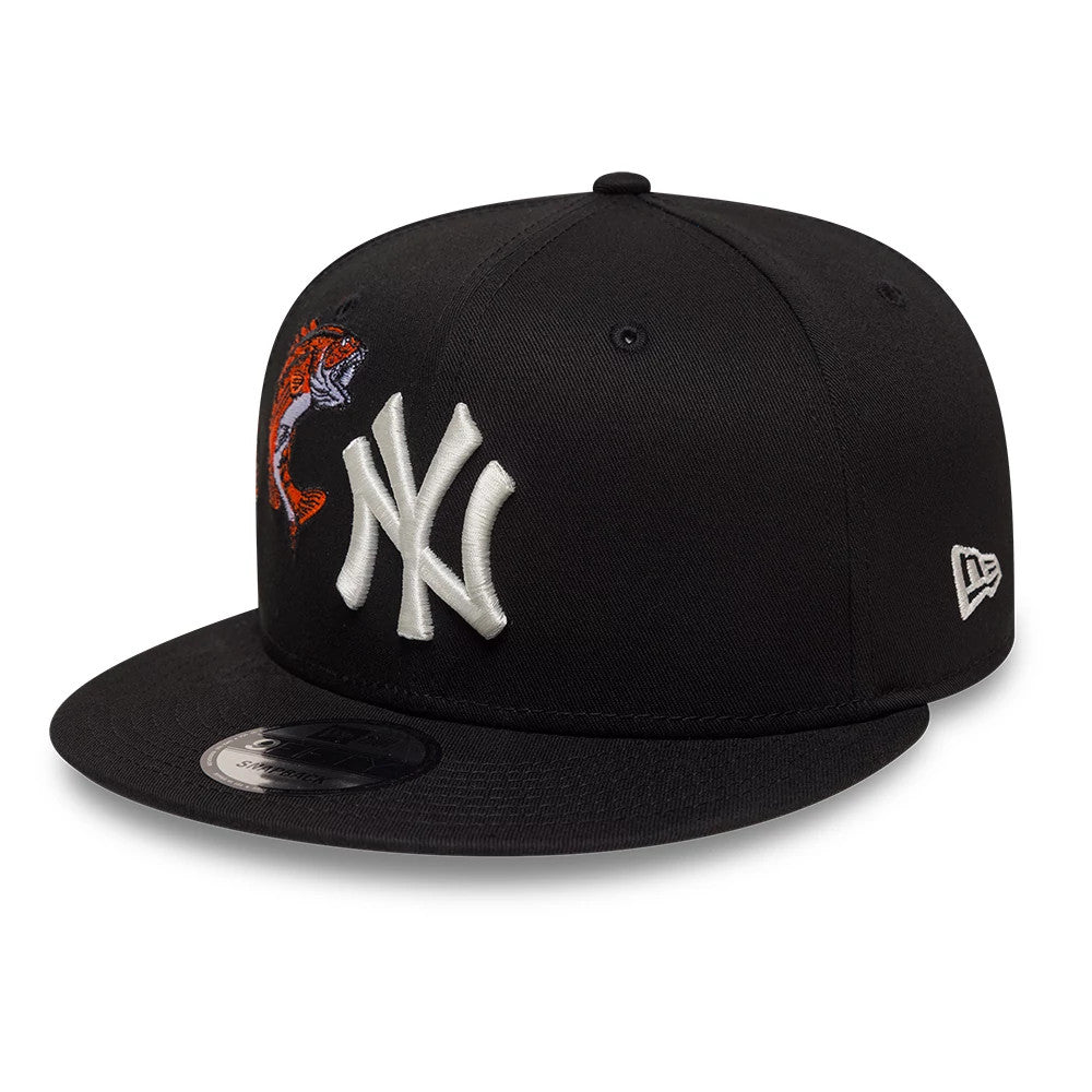 New York Yankees MLB Outdoor Icon Black New Era 9FIFTY Snapback Adjustable Cap, three-quarter view showing the white raised embroidered NY logo on the front panel, with a orange fish graphic, black flat visor, and New Era flag logo on the left side.