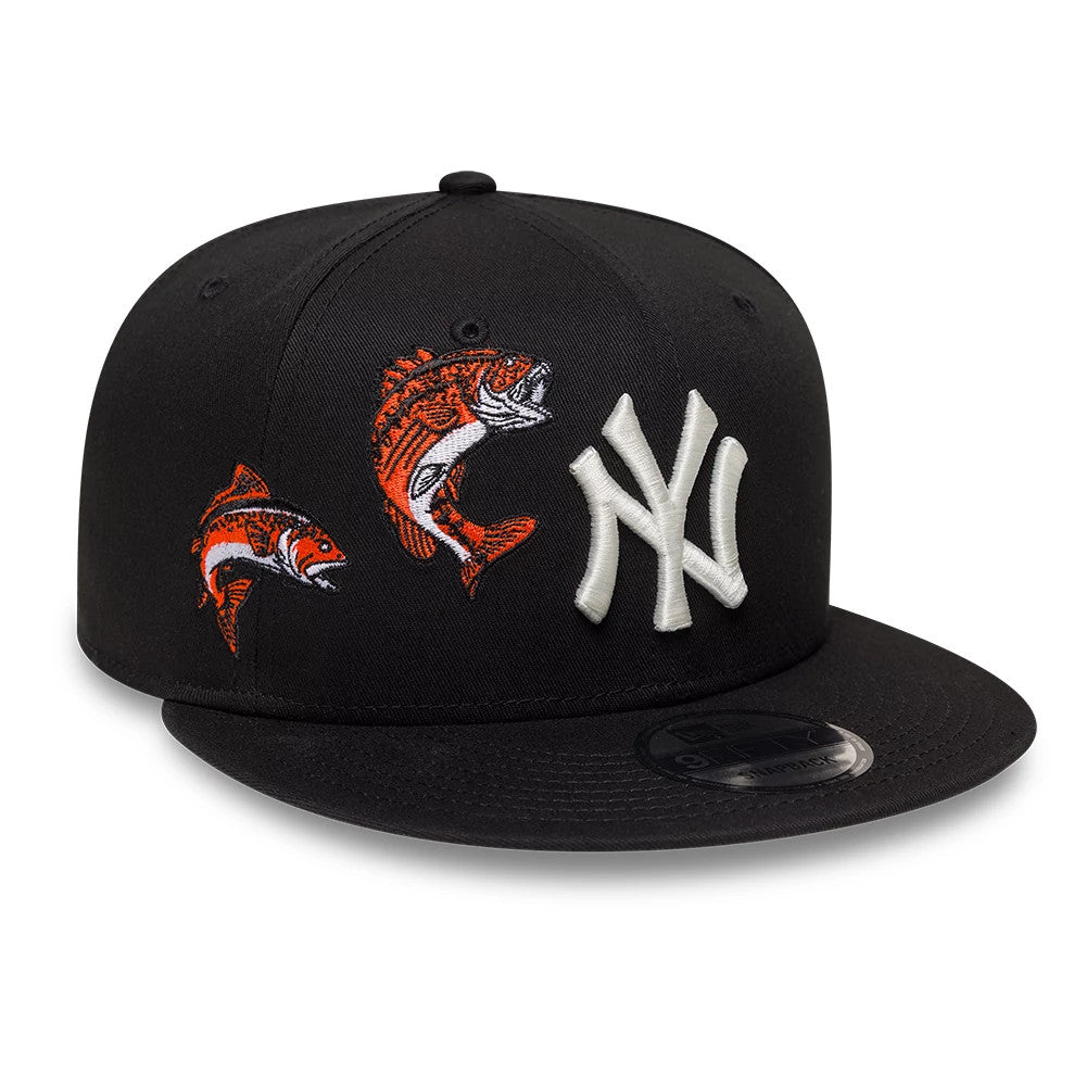New York Yankees MLB Outdoor Icon Black New Era 9FIFTY Snapback Adjustable Cap, front view showing white raised embroidered NY logo beside two orange and white fish graphics on the black front panels, with a 9FIFTY size sticker on the flat visor.