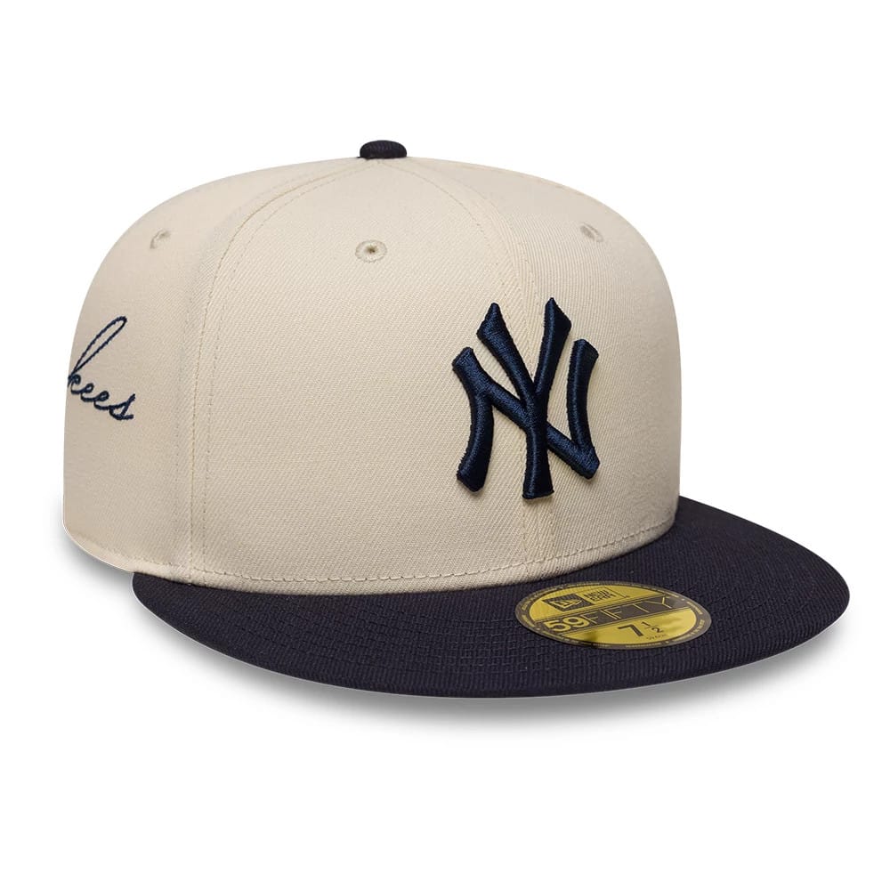 Pictured is this MLB Side Script New York Yankees 59FIFTY Fitted cap in cream & navy. 1
