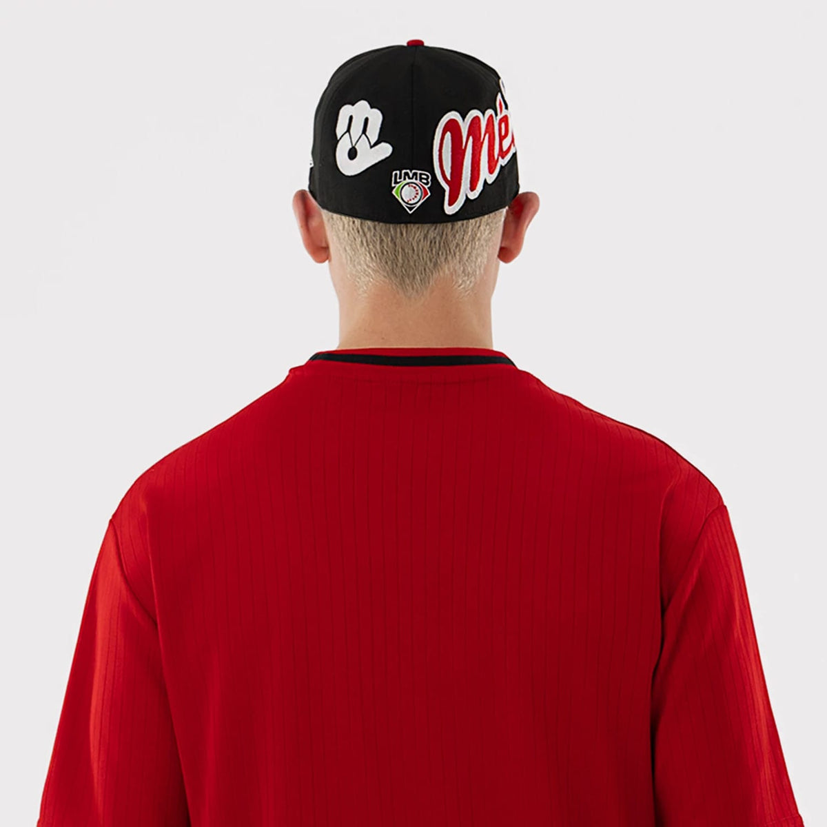 The model is wearing this LMB Mexico Diablos Oversized T-Shirt in red. 7