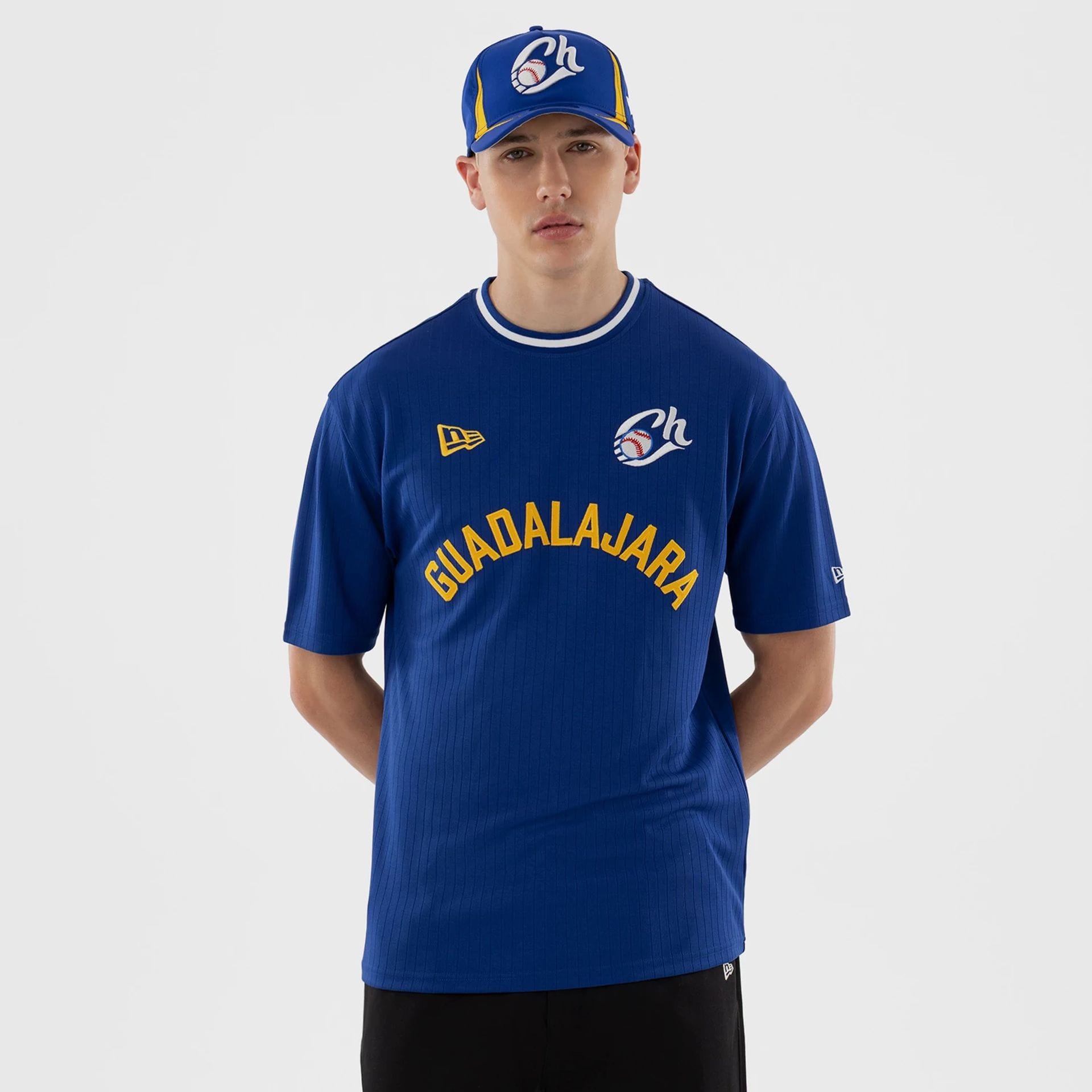 The model is wearing this LMB Charros De Jalisco T-Shirt in blue. 1