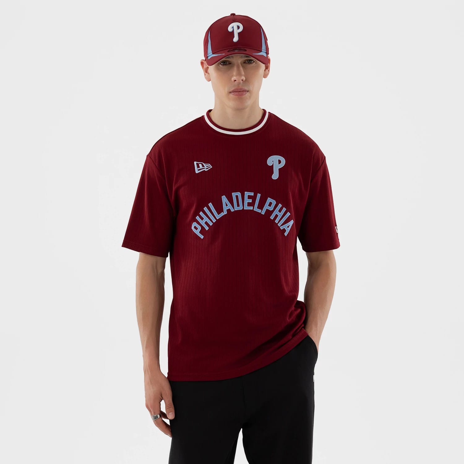 The model is wearing this MLB Philadelphia Phillies Oversized T-Shirt in dark red. 1