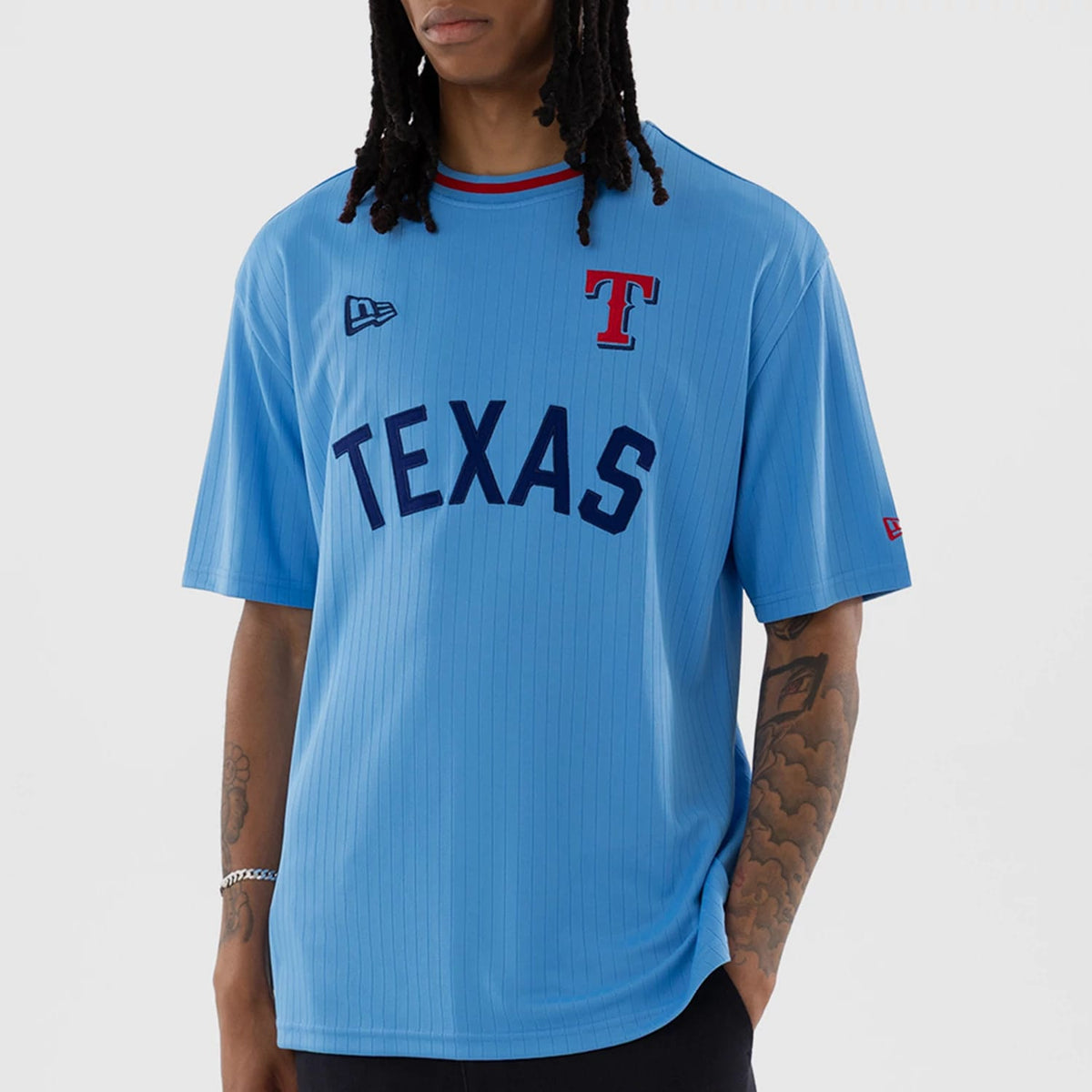 The model is wearing this MLB Texas Rangers Oversized T-Shirt in pastel blue. 7