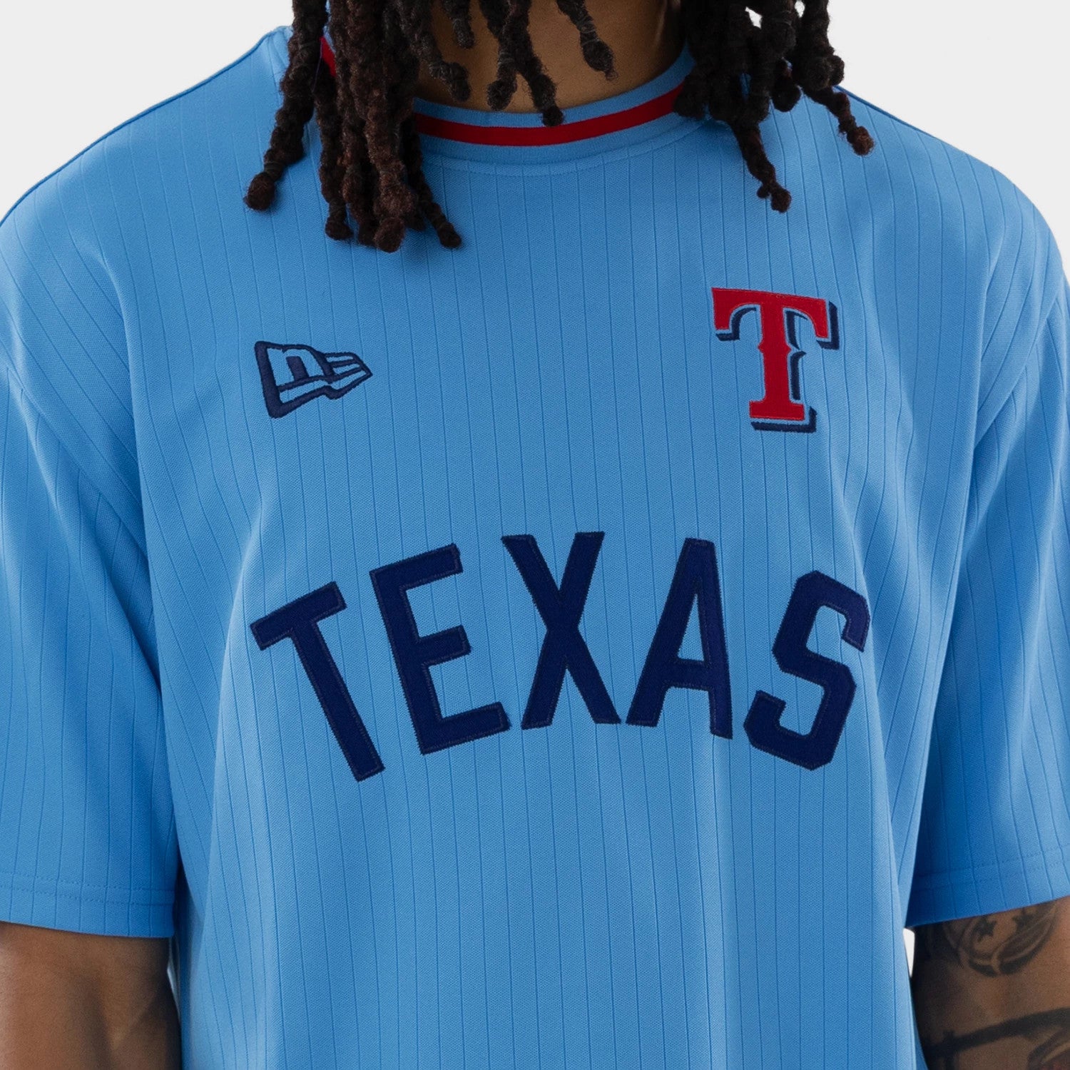 The model is wearing this MLB Texas Rangers Oversized T-Shirt in pastel blue. 4