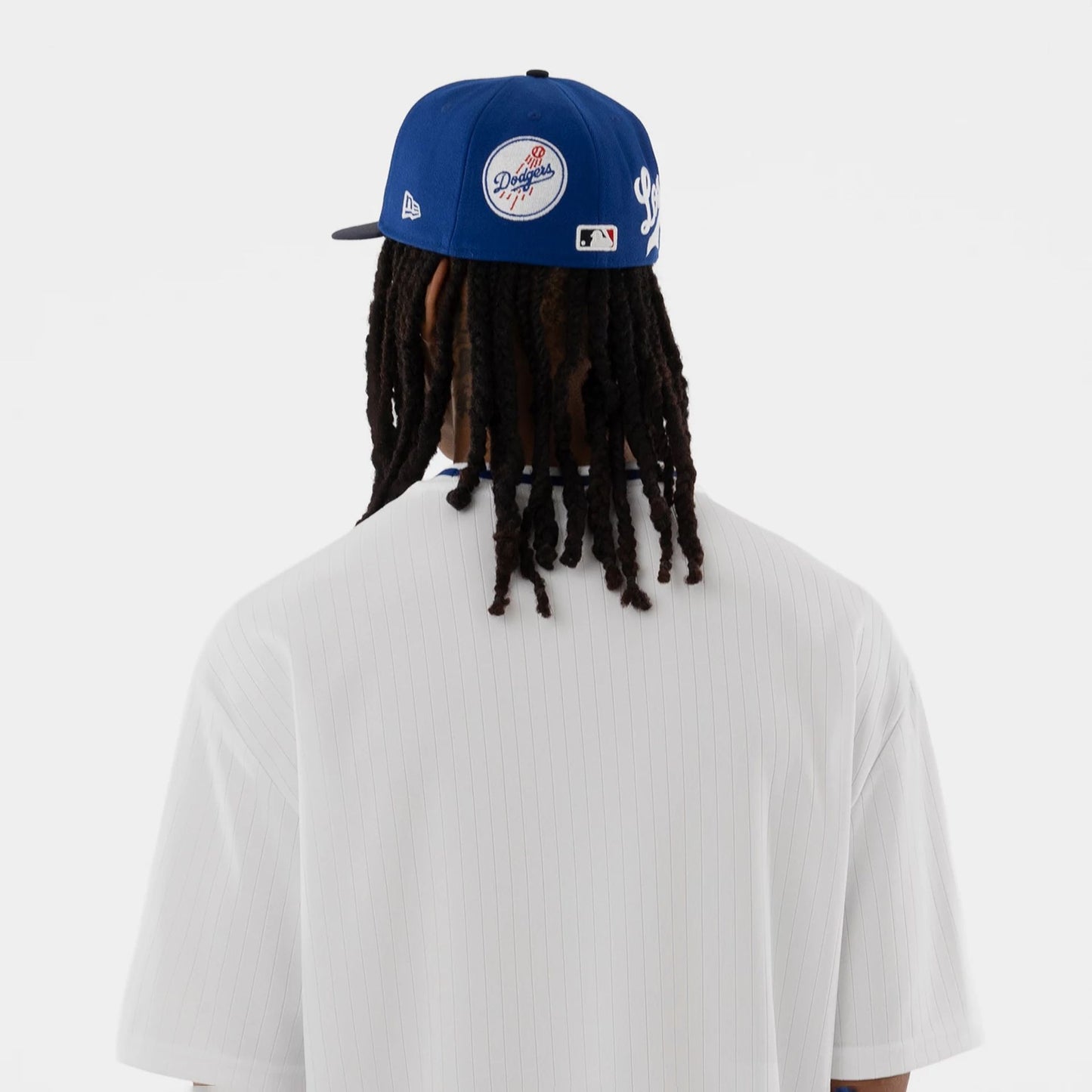 The model is wearing this MLB LA Dodgers T-Shirt in white. 7