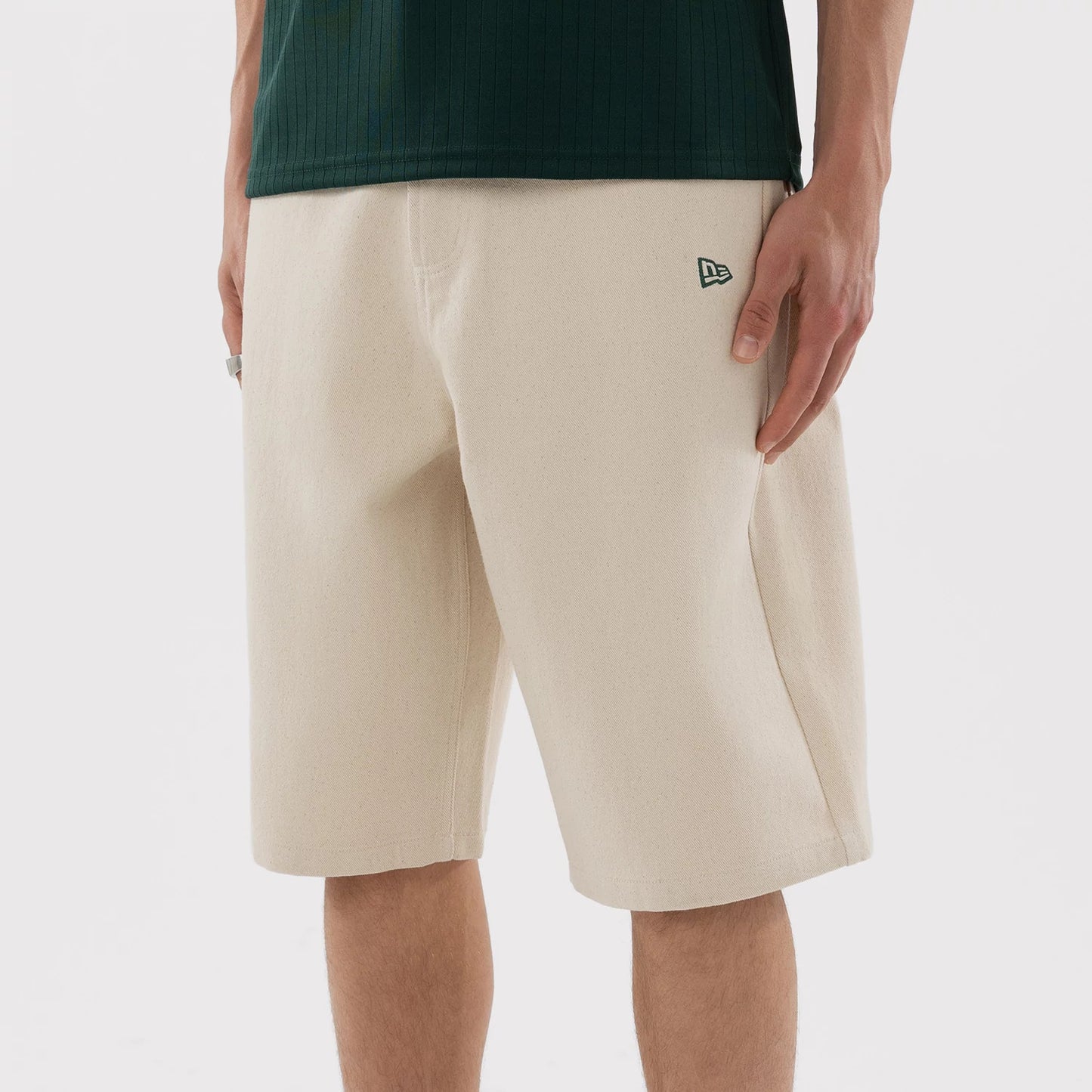 The model is wearing this MLB Jort Athletics Oversized Shorts in Cream. 7